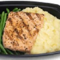 Grilled Alaskan Salmon · Grilled Alaskan salmon served on buttery mashed Yukon potatoes with green beans (Must reheat...