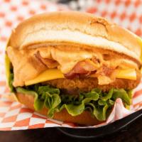 Chipotle Burger · Sesame seed bun, fried chicken patty, crispy bacon, American cheese, lettuce, tomato, and sp...