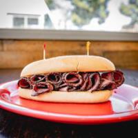 Pastrami Sandwich · Juicy pastrami, pickles, and mustard on a French roll.