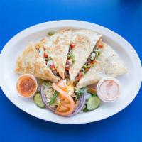 Quesadilla · Filled with choice of meat, bell peppers, onions, and cheese. Served with a small green salad.