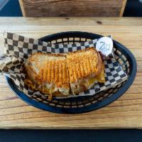 Adult Grilled Cheese Sandwich Combo · Cheddar, provolone, muenster, daily bacon finished with a Parmesan cheese crust on sourdough...