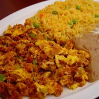 13. Huevos con Chorizo · Chorizo (pork sausage) scrambled with two eggs, onions and bell pepper. Served with beans, r...