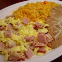 15. Huevos Con Jamon · Diced ham scrambled with two eggs. Served with beans, rice and tortillas. 