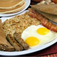 9. Breakfast Deluxe · Two pancakes, two eggs, two bacon strips and two sausages. Served with hash brown, toast and...