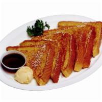 19. French Toast · Six triangular slices of french toast with powdered sugar. Served with butter and syrup. 