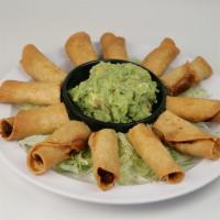 Taquitos Botana · Twelve halves of of beef or chicken taquitos with guacamole.