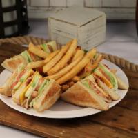 66. Club Sandwich · Choice of bread stuffed with turkey, mayonnaise, bacon, lettuce, tomato, avocado and cheese. 