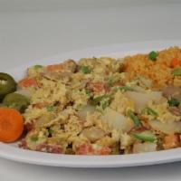 Papas a la Mexicana · Grilled potato grits, scrambled with two eggs, onions, tomato, cilantro and chile jalapeno. ...