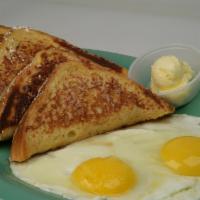 French Toast and Eggs · Four triangular slices of French toast with two eggs, powdered sugar and syrup or jelly.