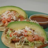 Taco Dillas/ Each · Two corn tortillas topped with melted jack cheese, de lo olla pinto beans, avocado, lettuce,...
