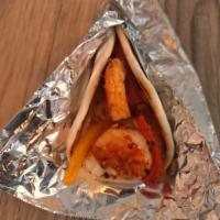 Shrimp Tacos · Sauteed shrimp with onions, peppers, rice and our homemade sauce served in a flour tortilla.