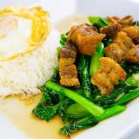 18. Crispy Pork and Chinese Broccoli · Stir-fried crispy pork with Chinese broccoli and oyster sauce over rice.