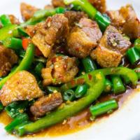 19. Crispy Pork and Mint Leaf · Crispy pork is stir-fried with a mint leaf and chili over rice. Spicy.