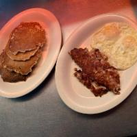 Hash and Eggs · Corned beef hash grilled and served with 2 eggs any style.
