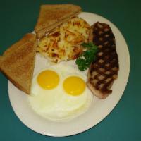 New York Steak and Eggs · 8  oz.  New York strip served with 2 eggs any style.