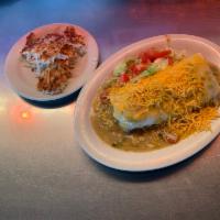 Breakfast Burrito · Large tortilla with scrambled eggs and sausage smothered in green chili, lettuce, tomato and...