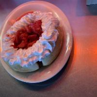 Strawberry Waffle · A waffle served with a cup of tasty strawberries and whipped topping.