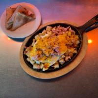 Ham and Cheese Skillet · 2 eggs, diced ham, cheese and country potatoes.