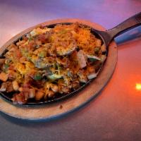 Santa Fe Chicken Skillet · 2 eggs, chicken, bell peppers, tomatoes, onions, Pueblo chili and country potatoes with shre...