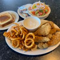 Chicken Tenders · Tender strips of breast fillets, breaded, fried and served with country gravy.