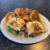 Club Melt · Turkey, ham and bacon on grilled sourdough bread with melted American cheese, lettuce and to...