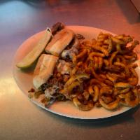 Philly Cheese Steak Sandwich · Thinly sliced steak grilled with onions and bell peppers with 2 slices of Swiss cheese and s...