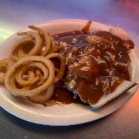 Hot Turkey Sandwich · Thinly sliced breast of turkey prepared open face on white bread and topped with brown gravy.