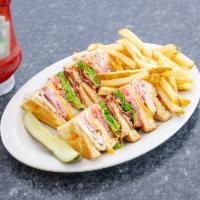 Club Sandwich · Bacon, ham and turkey with tomato, crisp lettuce, American cheese and mayonnaise on wheat to...