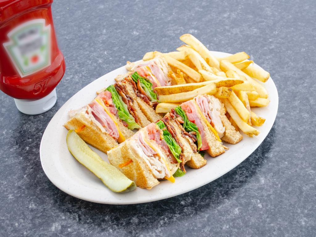 Club Sandwich · Bacon, ham and turkey with tomato, crisp lettuce, American cheese and mayonnaise on wheat toast.
