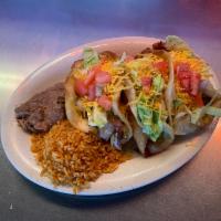 Deep Fried Tacos · White flour tortillas with beef or chicken, deep fried and then filled with shredded cheddar...