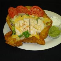 Santa Fe Chicken Salad · Seasoned grilled chicken breast on salad in a tomato basil bowl with shredded cheese and tom...