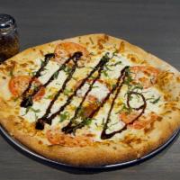 Margherita Pizza · Roasted garlic oil, Buffalo mozzarella, tomatoes and fresh basil with a balsamic glaze.