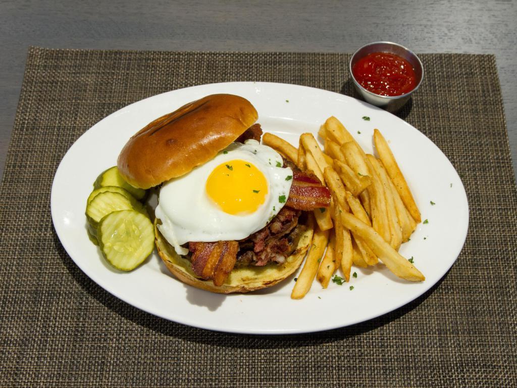 50's Burger · Topped with bacon, sausage, corned beef hash, a sunny side egg and cheddar cheese.