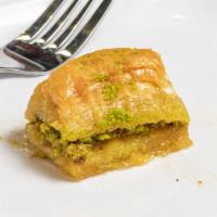 Baklava · Phyllo dough layers stuffed with walnut or pistachio soaked in sugar syrup.