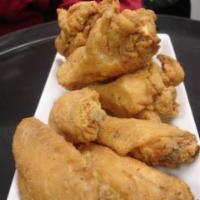 Southern Fried Wings · Our signature wings are lightly hand breaded, fried then served as is or tossed in your favo...
