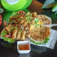 HW1. Saigon City Dac Biet · Combination plate of fried egg rolls, soft-shell crab, fried shrimp paste grilled pork skewe...