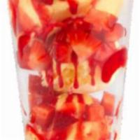 Tropical Paradise Creation · Non-dairy pina colada ice cream, strawberries and strawberry sundae.