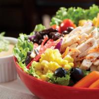 Southwest Chicken Salad · Grilled chicken, corn, black beans, jack and cheddar cheese, avocado, and tortilla strips on...