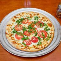BV Tomatoes White Pizza · Mozzarella, fresh garlic, Parmesan cheese, fresh basil, and fresh tomato.