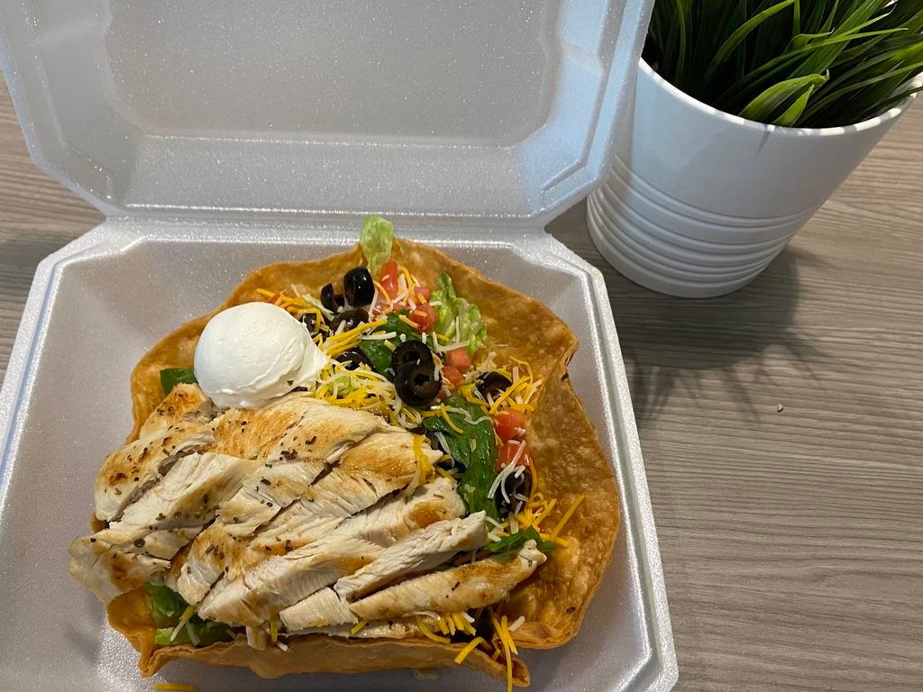 Whole Taco Salad · Taco shell with romaine lettuce, shredded cheese, tomato, black olives, sour cream, and your choice of meat- chicken or taco meat served with salsa.
