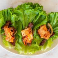 Korean Beef Lettuce Wraps Plate · Marinated beef, served with kimchi.