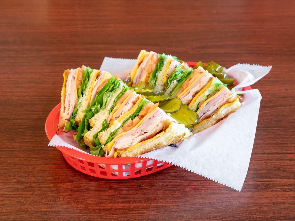 Club Sandwich · Three layers filled with fresh roasted turkey, ham, bacon, lettuce, tomato, and mayo.