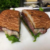 Pastrami  · Hot or cold
Sliced pastrami, Dijon mustard, tomatoes lettuce & red onions with provolone che...