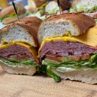 Salami cheddar · Salami, cheddar cheese, may, mustard, tomatoes, lettuce & onions on a French roll