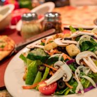 Green Salad · Mixed lettuce, tomatoes, mushrooms, carrots, olives, croutons, and mozzarella cheese served ...