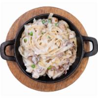 Country Alfredo Pasta · Fettuccine Noodles with Chicken, Bacon, and Mushrooms.
