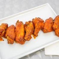 Chicken Wings · Oven baked full size wings, covered with choice of sauce and a side of blue cheese or ranch.