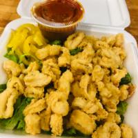 Fried Calamari · Flash fried squid, crunchy on the outside, and simply perfect on the inside. Kick it up a no...