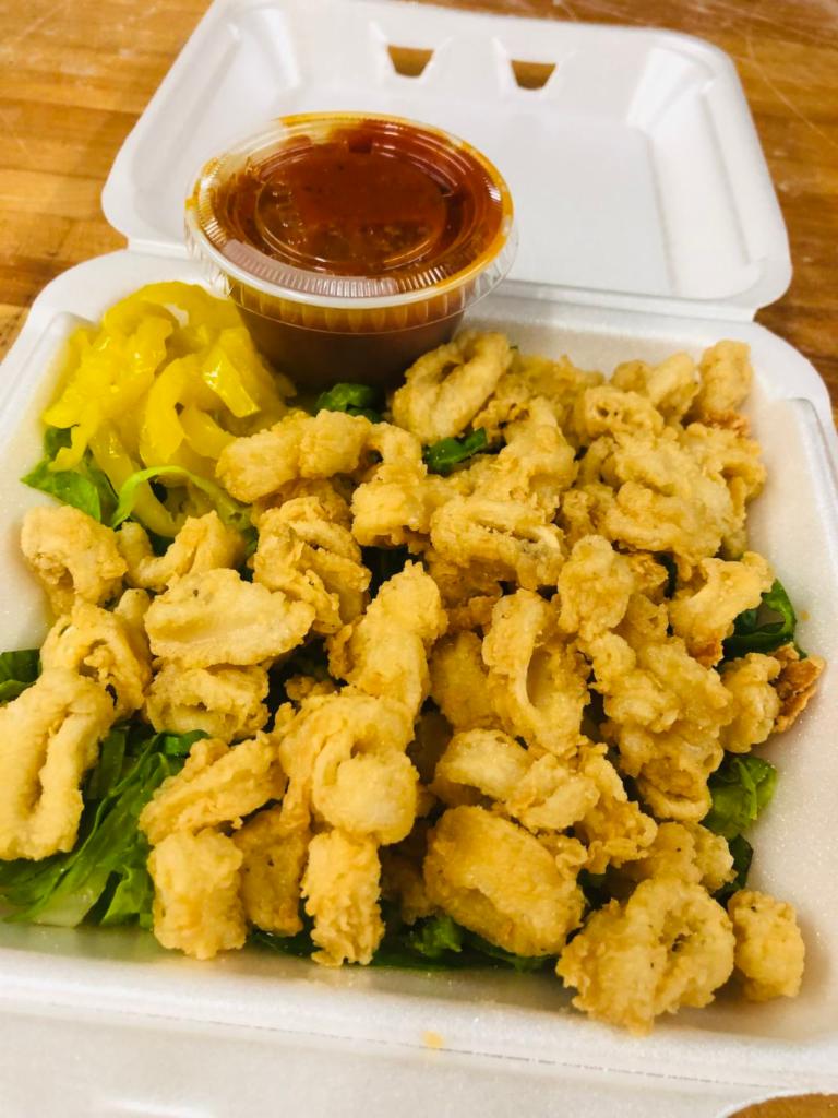 Fried Calamari · Flash fried squid, crunchy on the outside, and simply perfect on the inside. Kick it up a notch with a squeeze of lemon.
