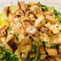 Grilled Chicken Caesar Salad · Green salad with Caesar dressing and cheese. Extra dressing for an additional charge.
